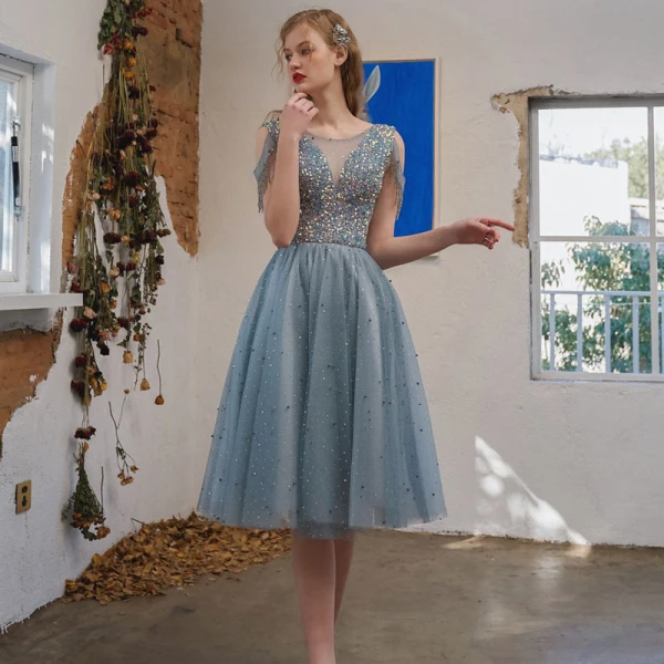 Scintillantes Bleu Ciel Robe De Graduation 2021 Princesse Encolure Dégagée Perlage Gland Paillettes Sans Manches Dos Nu Thé Longueur Soirée Robe De Ceremonie
