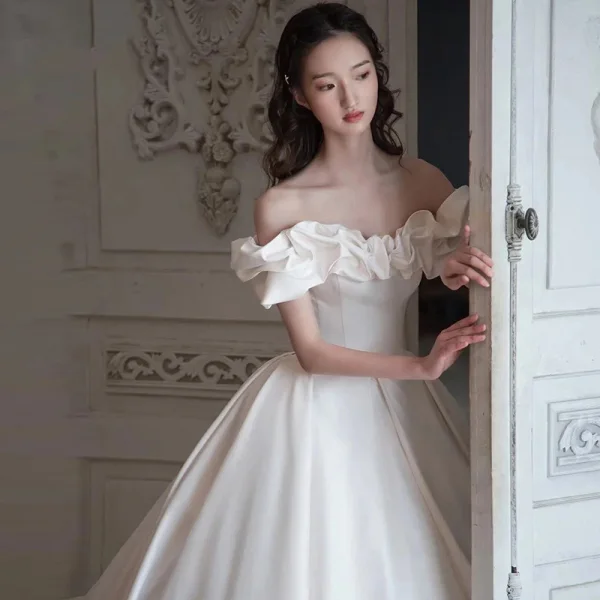 High-end Modest / Simple Ivory Satin Wedding Dresses 2021 Ball Gown Ruffle Off-The-Shoulder Short Sleeve Backless Royal Train Wedding