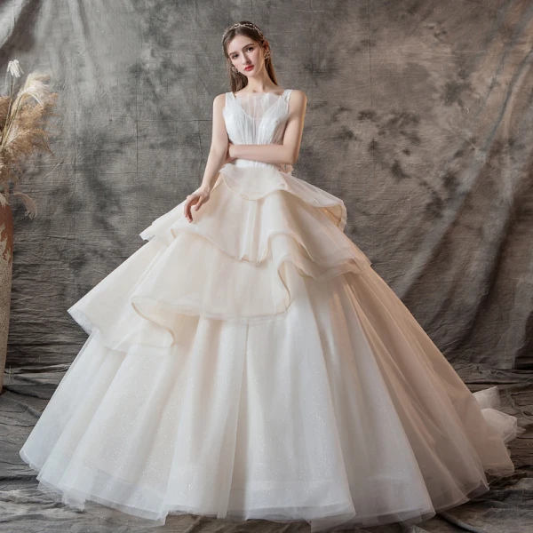 Charming Champagne Wedding Dresses 2019 Ball Gown V-Neck Pearl Sleeveless Backless Cascading Ruffles Cathedral Train