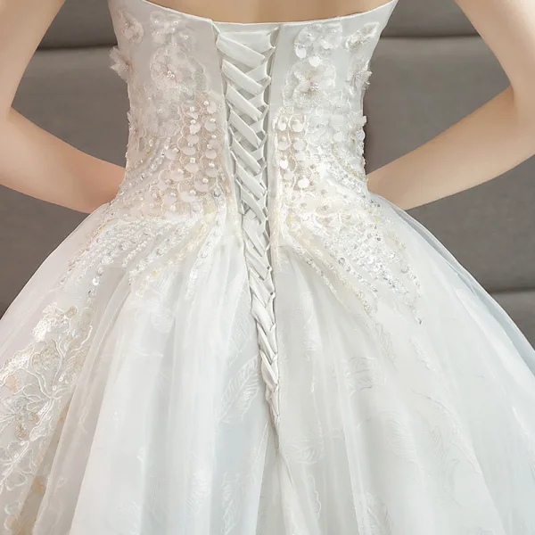 Edles Ivory / Creme Brautkleider / Hochzeitskleider 2019 A Linie Perlenstickerei Perle Pailletten Spitze Blumen Ärmellos Rückenfreies Königliche Schleppe