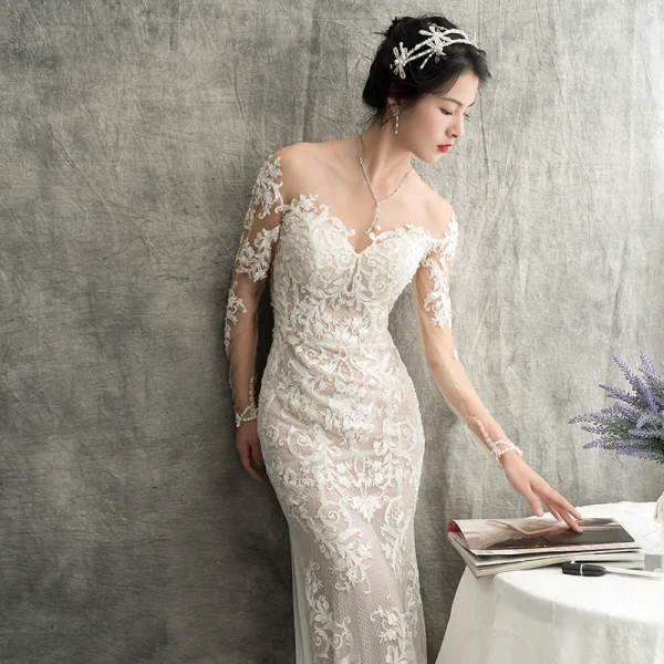 Charmant Ivory / Creme Durchsichtige Brautkleider / Hochzeitskleider 2018 Meerjungfrau Rundhalsausschnitt Lange Ärmel Applikationen Durchbohrt Spitze Kapelle-Schleppe