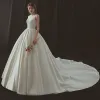 Modest / Simple Ivory Wedding Dresses 2018 Ball Gown Scoop Neck Sleeveless Backless Royal Train Ruffle