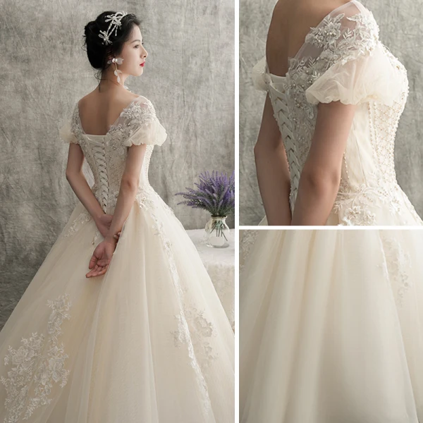 Schöne Champagner Brautkleider / Hochzeitskleider 2018 A Linie V-Ausschnitt Geschwollenes Kurze Ärmel Rückenfreies Applikationen Spitze Perlenstickerei Sweep / Pinsel Zug Rüschen