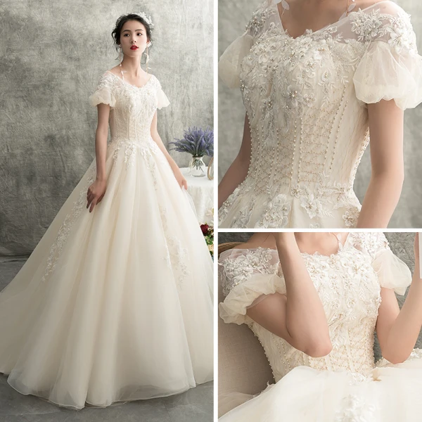 Schöne Champagner Brautkleider / Hochzeitskleider 2018 A Linie V-Ausschnitt Geschwollenes Kurze Ärmel Rückenfreies Applikationen Spitze Perlenstickerei Sweep / Pinsel Zug Rüschen