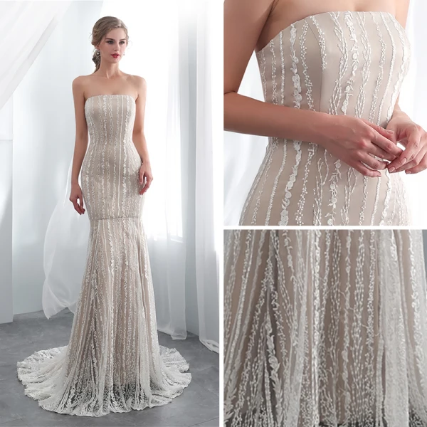 Chic / Belle Champagne Robe De Soirée 2018 Trompette / Sirène Bustier Sans Manches Appliques En Dentelle Tribunal Train Volants Dos Nu Robe De Ceremonie