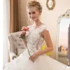 Illusion Ivory See-through Wedding Dresses 2018 Ball Gown Scoop Neck Sleeveless Appliques Flower Beading Pearl Cathedral Train Ruffle