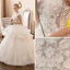 Illusion Ivoire Transparentes Robe De Mariée 2018 Robe Boule Encolure Dégagée Sans Manches Appliques Fleur Perlage Perle Cathedral Train Volants