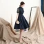 Modern / Fashion Navy Blue Homecoming Graduation Dresses 2018 A-Line / Princess High Neck See-through Short Sleeve Appliques Lace Beading Knee-Length Ruffle Backless Formal Dresses