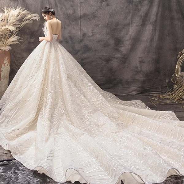 Luxury / Gorgeous Champagne Wedding Dresses 2019 Ball Gown Spaghetti Straps Sequins Sleeveless Backless Bow Royal Train