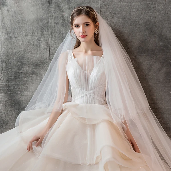 Charming Champagne Wedding Dresses 2019 Ball Gown V-Neck Pearl Sleeveless Backless Cascading Ruffles Cathedral Train