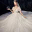 High-end Ivory Wedding Dresses 2020 Ball Gown V-Neck Beading Pearl Sequins Lace Flower Appliques Short Sleeve Backless Royal Train