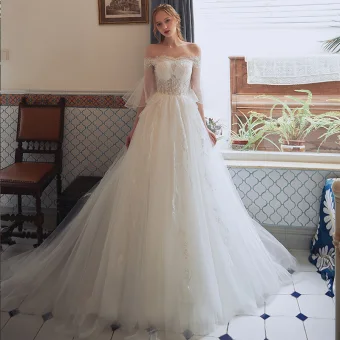 Affordable Champagne Wedding Dresses 2018 A Line Princess Off The Shoulder 3 4 Sleeve Backless Appliques Lace Court Train Ruffle