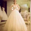 Chic / Beautiful Champagne Pierced Wedding Dresses 2017 Ball Gown Scoop Neck Long Sleeve Backless Appliques Flower Beading Bow Sash Floor-Length / Long