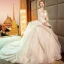 Audrey Hepburn Style Champagne Wedding Dresses 2019 Ball Gown See-through Scoop Neck Lace Appliques 3/4 Sleeve Backless Cascading Ruffles Royal Train