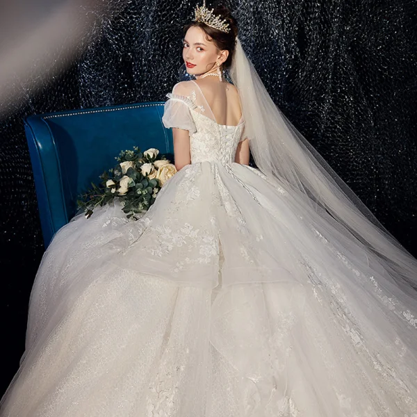 High-end Ivory Wedding Dresses 2020 Ball Gown V-Neck Beading Pearl Sequins Lace Flower Appliques Short Sleeve Backless Royal Train