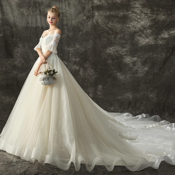 Schöne Champagner Brautkleider / Hochzeitskleider 2018 Ballkleid Off Shoulder 1/2 Ärmel Rückenfreies Applikationen Spitze Glanz Pailletten Kathedrale Schleppe Rüschen