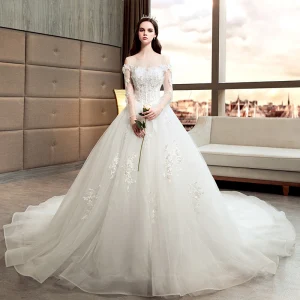 Chic Belle Ivoire Robe De Mariée 2018 Princesse Transparentes Encolure Dégagée Manches Longues Dos Nu Appliques En Dentelle Perlage Perle Cathedral Train Volants