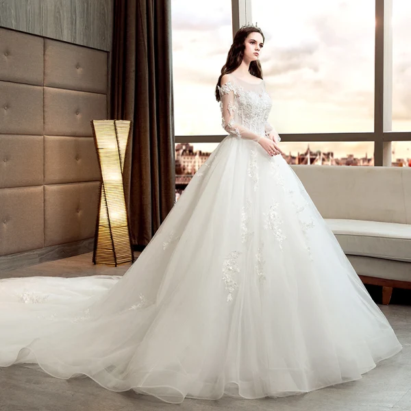 Chic / Belle Ivoire Robe De Mariée 2018 Princesse Transparentes Encolure Dégagée Manches Longues Dos Nu Appliques En Dentelle Perlage Perle Cathedral Train Volants
