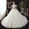 Vintage / Retro Ivory See-through Wedding Dresses 2020 Ball Gown High Neck Short Sleeve Backless Appliques Lace Beading Chapel Train Ruffle