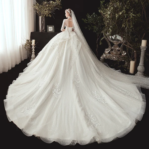 Romantique Ivoire Transparentes Robe De Mariée 2020 Robe Boule Encolure Dégagée 1/2 Manches Dos Nu Glitter Tulle Étoile Appliques En Dentelle Chapel Train Volants