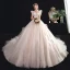 Chic / Belle Transparentes Champagne Robe De Mariée 2020 Robe Boule Col Haut Sans Manches Dos Nu Appliques En Dentelle Perlage Cathedral Train Volants