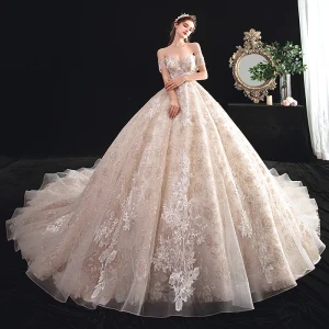 Schöne Champagner Durchsichtige Brautkleider Hochzeitskleider 2020 Ballkleid Off Shoulder Kurze Ärmel Rückenfreies Perlenstickerei Quaste Applikationen Spitze Kathedrale Schleppe Rüschen