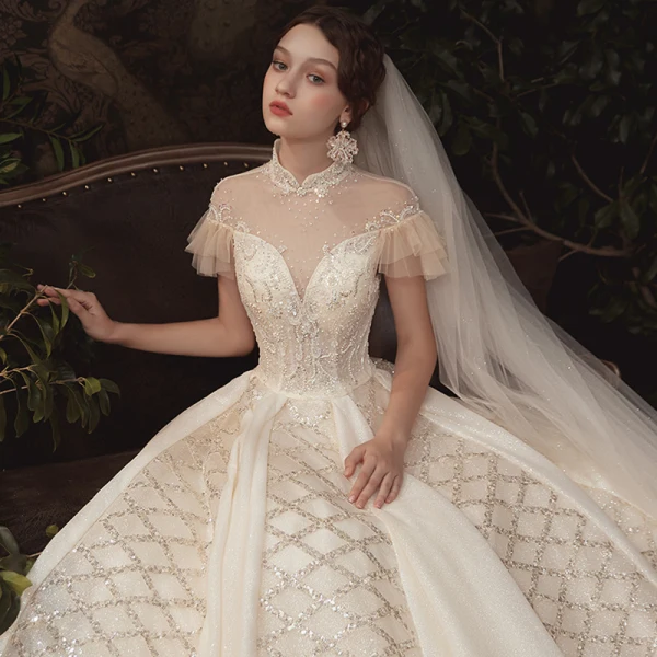 Haut de Gamme Champagne Transparentes Robe De Mariée 2020 Robe Boule Col Haut Manches Courtes Dos Nu Fait main Perlage Glitter Tulle Royal Train