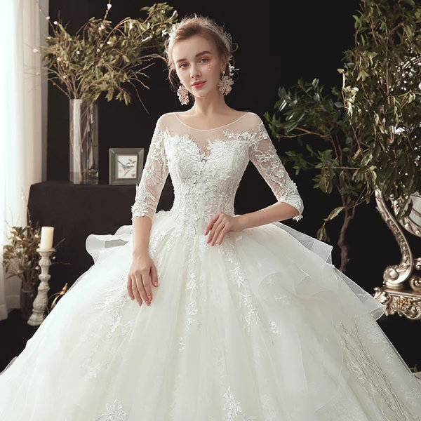 Chic / Belle Ivoire Transparentes Robe De Mariée 2020 Robe Boule Encolure Dégagée 3/4 Manches Appliques En Dentelle Perle Chapel Train Volants Dos Nu