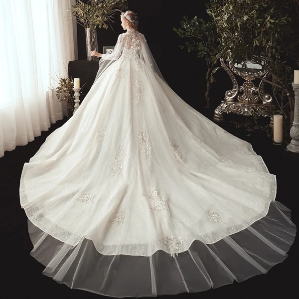 Conte de fée Champagne Transparentes Robe De Mariée Avec Cape 2020 Robe Boule Col Haut 3/4 Manches Dos Nu Appliques En Dentelle Perlage Watteau Train Volants