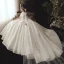 Conte de fée Champagne Transparentes Robe De Mariée Avec Cape 2020 Robe Boule Col Haut 3/4 Manches Dos Nu Appliques En Dentelle Perlage Watteau Train Volants