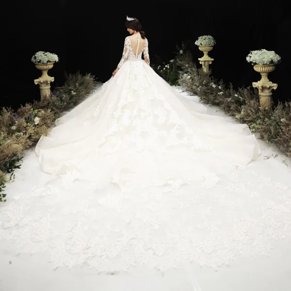 Luxury / Gorgeous Champagne See-through Wedding Dresses 2020 Ball Gown Scoop Neck Long Sleeve Pierced Appliques Lace Beading Royal Train Ruffle