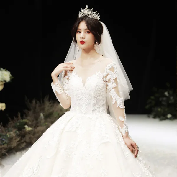 Luxury / Gorgeous Champagne See-through Wedding Dresses 2020 Ball Gown Scoop Neck Long Sleeve Pierced Appliques Lace Beading Royal Train Ruffle