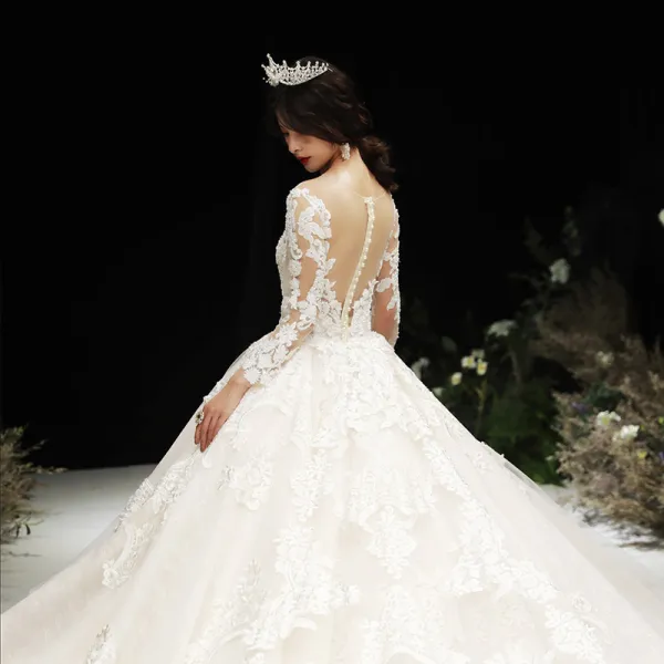 Luxury / Gorgeous Champagne See-through Wedding Dresses 2020 Ball Gown Scoop Neck Long Sleeve Pierced Appliques Lace Beading Royal Train Ruffle