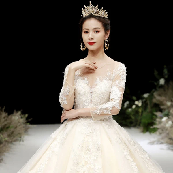 Charming Champagne See-through Wedding Dresses 2020 Ball Gown Scoop Neck 3/4 Sleeve Appliques Lace Beading Glitter Tulle Cathedral Train Ruffle