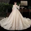 Chic / Belle Champagne Transparentes Grande Taille Robe De Mariée 2020 Encolure Dégagée Gonflée 3/4 Manches Dos Nu Appliques En Dentelle Perlage Cathedral Train Volants