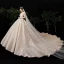 Fabuleux Champagne Transparentes Étoile Robe De Mariée 2020 Robe Boule Encolure Carrée Manches Longues Dos Nu Glitter Tulle Fait main Perlage Cathedral Train Volants