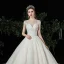 Meilleur Champagne Dentelle Robe De Mariée 2020 Robe Boule Transparentes Encolure Carrée Manches Courtes Appliques En Dentelle Perlage Chapel Train Volants