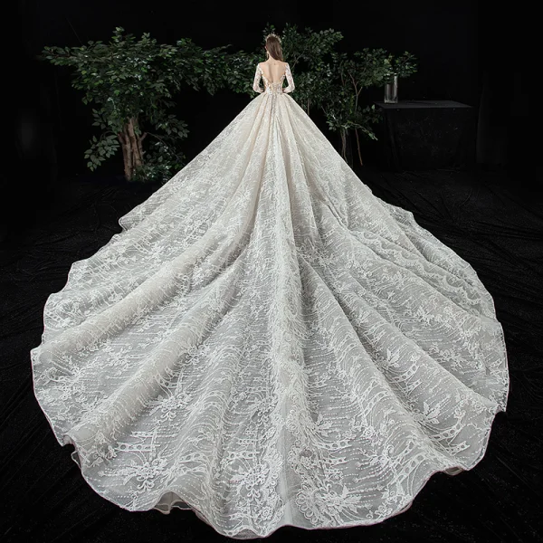 Charmant Champagne Transparentes Robe De Mariée 2020 Robe Boule Encolure Dégagée Manches Longues Dos Nu Glitter Tulle Appliques En Dentelle Perlage Royal Train Volants