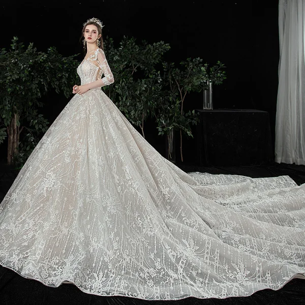 Charmant Champagne Transparentes Robe De Mariée 2020 Robe Boule Encolure Dégagée Manches Longues Dos Nu Glitter Tulle Appliques En Dentelle Perlage Royal Train Volants