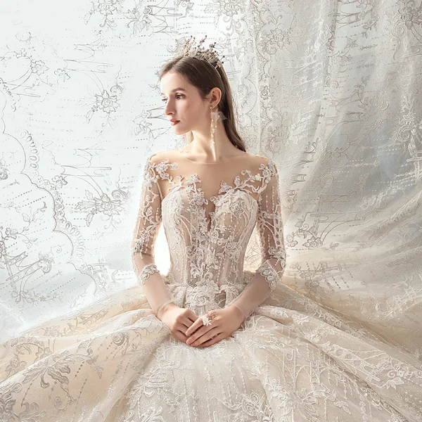 Charmant Champagne Transparentes Robe De Mariée 2020 Robe Boule Encolure Dégagée Manches Longues Dos Nu Glitter Tulle Appliques En Dentelle Perlage Royal Train Volants