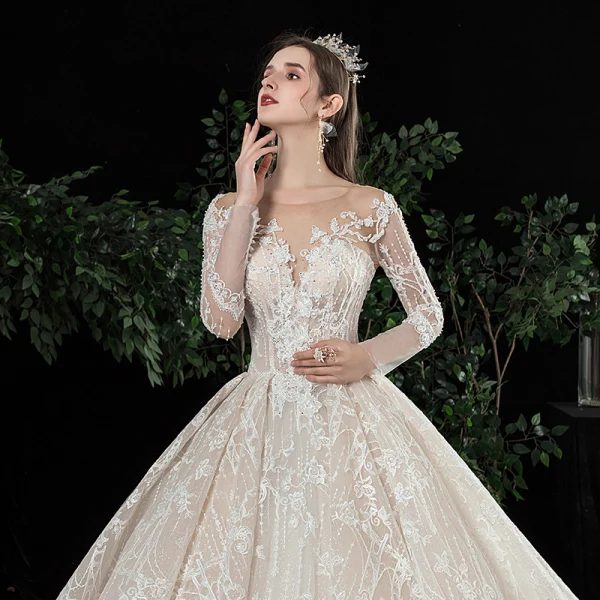 Charmant Champagne Transparentes Robe De Mariée 2020 Robe Boule Encolure Dégagée Manches Longues Dos Nu Glitter Tulle Appliques En Dentelle Perlage Royal Train Volants