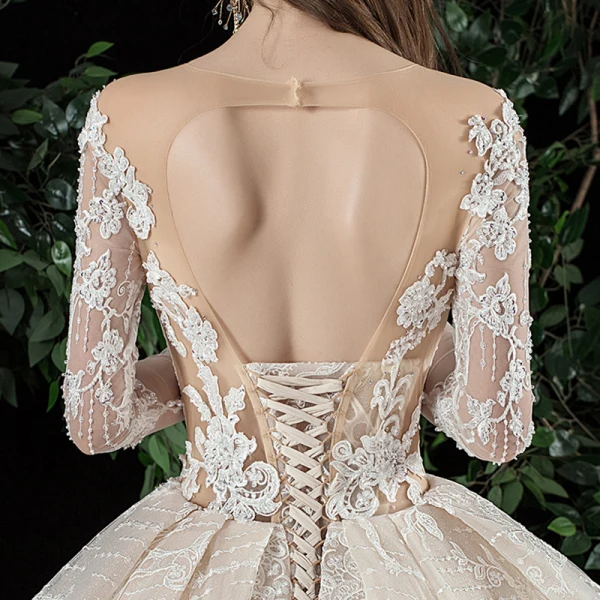 Charmant Champagne Transparentes Robe De Mariée 2020 Robe Boule Encolure Dégagée Manches Longues Dos Nu Glitter Tulle Appliques En Dentelle Perlage Royal Train Volants