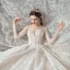 Charmant Champagne Transparentes Robe De Mariée 2020 Robe Boule Encolure Dégagée Manches Longues Dos Nu Glitter Tulle Appliques En Dentelle Perlage Royal Train Volants