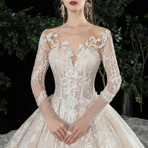 Charmant Champagne Transparentes Robe De Mariée 2020 Robe Boule Encolure Dégagée Manches Longues Dos Nu Glitter Tulle Appliques En Dentelle Perlage Royal Train Volants