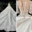 Charmant Champagne Transparentes Robe De Mariée 2020 Robe Boule Encolure Dégagée Manches Longues Dos Nu Glitter Tulle Appliques En Dentelle Perlage Royal Train Volants