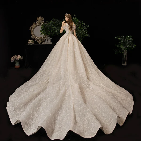 Luxury / Gorgeous Champagne See-through Wedding Dresses 2020 Ball Gown Scoop Neck Short Sleeve Backless Glitter Appliques Lace Beading Tassel Chapel Train Ruffle