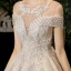 Luxury / Gorgeous Champagne See-through Wedding Dresses 2020 Ball Gown Scoop Neck Short Sleeve Backless Glitter Appliques Lace Beading Tassel Chapel Train Ruffle