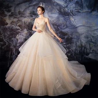 Best Champagne Outdoor Garden Wedding Dresses 2020 Ball Gown Spaghetti Straps Sleeveless Backless Glitter Tulle Beading Sweep Train Ruffle