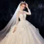 Vintage / Originale Ivoire Transparentes Robe De Mariée 2020 Robe Boule Col Haut Manches Longues Dos Nu Glitter Tulle Appliques En Dentelle Perlage Chapel Train Volants
