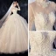 Vintage / Originale Ivoire Transparentes Robe De Mariée 2020 Robe Boule Col Haut Manches Longues Dos Nu Glitter Tulle Appliques En Dentelle Perlage Chapel Train Volants